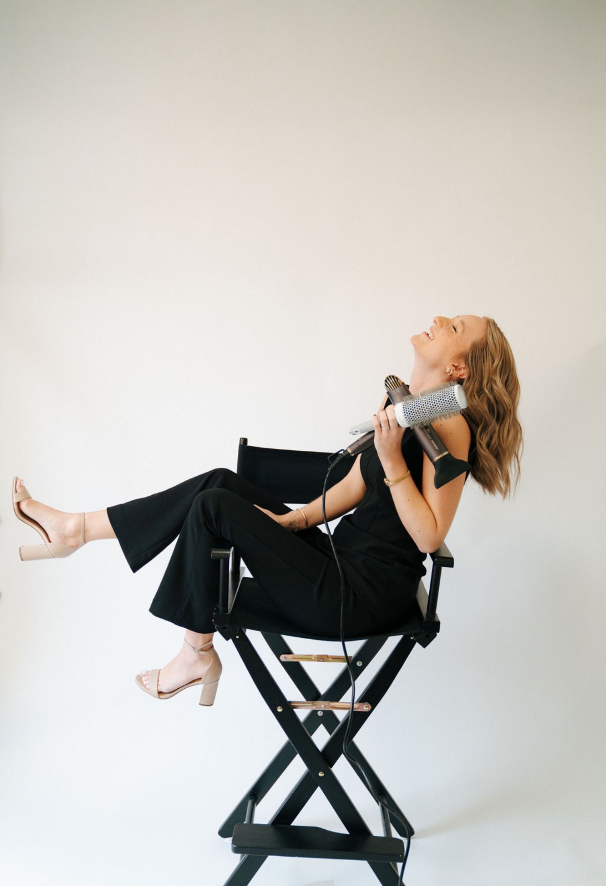 Brooklyn laughing in her studio chair.
